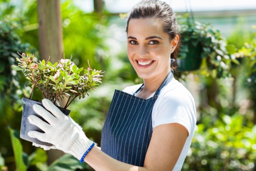 Team member tending to a community garden in Sudbury, showing accessible pathways