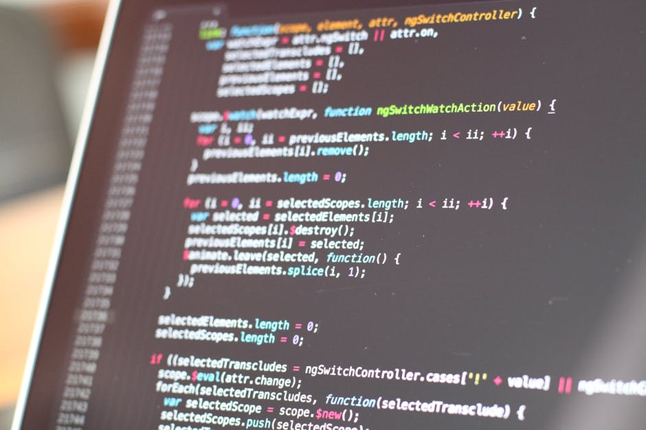 A close-up view of a computer screen displaying colorful lines of programming code, including syntax highlighting in neon pink, blue, green, and yellow. The code appears to be JavaScript, with functio
